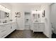 Modern bathroom with double vanities, chevron-patterned floors, and a walk-in closet at 6355 Glen Oaks Ln, Atlanta, GA 30328