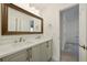 Bathroom boasts a double vanity with white marble countertop and a large framed mirror at 6355 Glen Oaks Ln, Atlanta, GA 30328