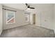 Spacious bedroom features two large windows and an ensuite bathroom at 6355 Glen Oaks Ln, Atlanta, GA 30328