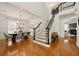 Spacious foyer showcases hardwood floors and staircase, transitioning into the formal dining and living areas at 6355 Glen Oaks Ln, Atlanta, GA 30328