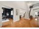 Stunning foyer with gleaming hardwood floors, a staircase, and an open view into the living spaces at 6355 Glen Oaks Ln, Atlanta, GA 30328