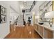Grand foyer featuring hardwood floors, a staircase with black railings, and stylish decor at 6355 Glen Oaks Ln, Atlanta, GA 30328