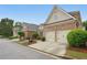 Lovely brick home with a two-car garage and landscaped front yard in a peaceful neighborhood setting at 6355 Glen Oaks Ln, Atlanta, GA 30328