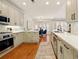 Beautiful kitchen with modern appliances, ample storage, eat in table with natural light and hardwood floors at 6355 Glen Oaks Ln, Atlanta, GA 30328