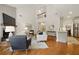 Sunlit living room featuring high ceilings, hardwood floors, and open-concept layout at 6355 Glen Oaks Ln, Atlanta, GA 30328