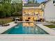 Stunning backyard with a pool, patio, multiple decks, and lush landscaping at 650 Jones Rd, Roswell, GA 30075