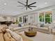Spacious finished basement with sectional sofa, pool table, kitchenette, and large windows at 650 Jones Rd, Roswell, GA 30075