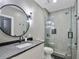Contemporary bathroom featuring a sleek vanity, modern fixtures, and a glass-enclosed walk-in shower at 650 Jones Rd, Roswell, GA 30075