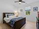 Cozy bedroom with a classic wooden bed frame, stylish bedding, and serene window view at 650 Jones Rd, Roswell, GA 30075