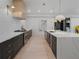 A modern kitchen with a large island, stylish countertops, pendant lighting, and premium appliances at 650 Jones Rd, Roswell, GA 30075