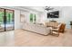Bright and airy living room with hardwood floors, comfortable seating, and backyard pool access at 650 Jones Rd, Roswell, GA 30075