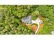 Drone shot of a home surrounded by verdant trees, featuring a driveway and detached garage at 11 Headden Nw Rdg, Cartersville, GA 30121