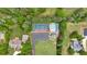 Aerial view showcasing a tennis court and pool nestled among lush greenery at 11 Headden Nw Rdg, Cartersville, GA 30121