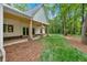View of the home's back exterior showing a covered patio and large grassy yard at 11 Headden Nw Rdg, Cartersville, GA 30121