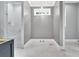 Bathroom showcases a modern walk-in shower, chandelier, and a neutral color palette at 11 Headden Nw Rdg, Cartersville, GA 30121