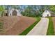 View up the long driveway to home with separate building on the property at 11 Headden Nw Rdg, Cartersville, GA 30121