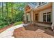 Gorgeous front porch with stone columns and exposed timber detailing at 11 Headden Nw Rdg, Cartersville, GA 30121