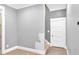 Hallway with light gray walls, white trim, and access to stairs and a closet at 11 Headden Nw Rdg, Cartersville, GA 30121