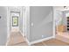 Hallway with natural light, neutral colors, and views into other unfinished rooms at 11 Headden Nw Rdg, Cartersville, GA 30121