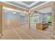 Bright, open-concept living room featuring exposed beams, modern lighting, and access to the outdoors at 11 Headden Nw Rdg, Cartersville, GA 30121