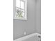 Bright bathroom corner with a window overlooking trees, painted in a modern neutral color at 11 Headden Nw Rdg, Cartersville, GA 30121