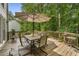 Back deck with a patio dining set and wooded views at 1519 Brookcliff Cir, Marietta, GA 30062
