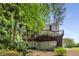 Lush backyard featuring a wooden deck and mature trees at 1519 Brookcliff Cir, Marietta, GA 30062