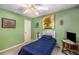 Cozy bedroom features blue decor, natural light, and a ceiling fan at 1519 Brookcliff Cir, Marietta, GA 30062