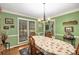 Formal dining room with traditional decor, large windows, and elegant chandelier at 1519 Brookcliff Cir, Marietta, GA 30062