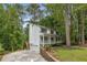 Traditional two-story home with a lovely front porch and lush greenery surrounding the property at 1519 Brookcliff Cir, Marietta, GA 30062