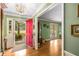 Welcoming foyer with a vibrant red door, hardwood floors and ample natural light at 1519 Brookcliff Cir, Marietta, GA 30062