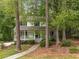 Charming home exterior with a welcoming front porch and mature trees at 1519 Brookcliff Cir, Marietta, GA 30062