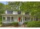 Charming two-story home featuring a welcoming front porch and well-maintained landscaping at 1519 Brookcliff Cir, Marietta, GA 30062