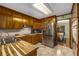 Spacious kitchen with stainless steel refrigerator, wood cabinets, and modern appliances at 1519 Brookcliff Cir, Marietta, GA 30062