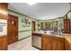 Bright kitchen with stainless appliances, wood cabinets, and a breakfast nook overlooking backyard at 1519 Brookcliff Cir, Marietta, GA 30062