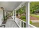 Inviting covered porch with plants and seating, perfect for enjoying the outdoors at 1519 Brookcliff Cir, Marietta, GA 30062