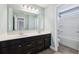 Bathroom featuring dual sinks, vanity with storage, and a shower/tub combination at 3750 Thackary Dr, Powder Springs, GA 30127
