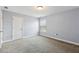 Bedroom showing carpet flooring, natural light, and door leading to another room at 3750 Thackary Dr, Powder Springs, GA 30127