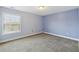 Bedroom showcasing blue walls, carpet flooring, and a window with blinds at 3750 Thackary Dr, Powder Springs, GA 30127