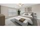 Primary bedroom featuring carpet, a ceiling fan, and a window at 3750 Thackary Dr, Powder Springs, GA 30127