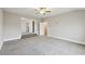 Bonus room with carpet flooring, neutral walls, and open doorways to other areas at 3750 Thackary Dr, Powder Springs, GA 30127