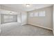 Bonus room with soft carpet, natural light, and ample space at 3750 Thackary Dr, Powder Springs, GA 30127