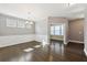 Formal dining room featuring hardwood floors, wainscoting, a chandelier and a neutral wall color at 3750 Thackary Dr, Powder Springs, GA 30127