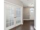 Foyer showing French doors, hardwood flooring, a gray wall color, and a white-painted front door at 3750 Thackary Dr, Powder Springs, GA 30127