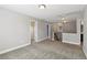 Upstairs hallway with gray carpet and multiple doorways at 3750 Thackary Dr, Powder Springs, GA 30127