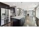 View of kitchen island, stainless steel appliances, and adjacent living room at 3750 Thackary Dr, Powder Springs, GA 30127