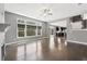 Open living space features hardwood floors, fireplace, and a view of the kitchen at 3750 Thackary Dr, Powder Springs, GA 30127