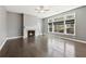 Bright living room featuring dark wood floors, a fireplace, and large windows at 3750 Thackary Dr, Powder Springs, GA 30127