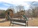 Community playground featuring wooden structures with slides and swings for enjoyment at 3750 Thackary Dr, Powder Springs, GA 30127