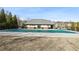 Community pool covered for the off-season, with a pool house in the background at 3750 Thackary Dr, Powder Springs, GA 30127